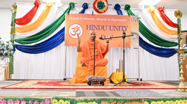 Hindu religious leader giving a talk from a podium