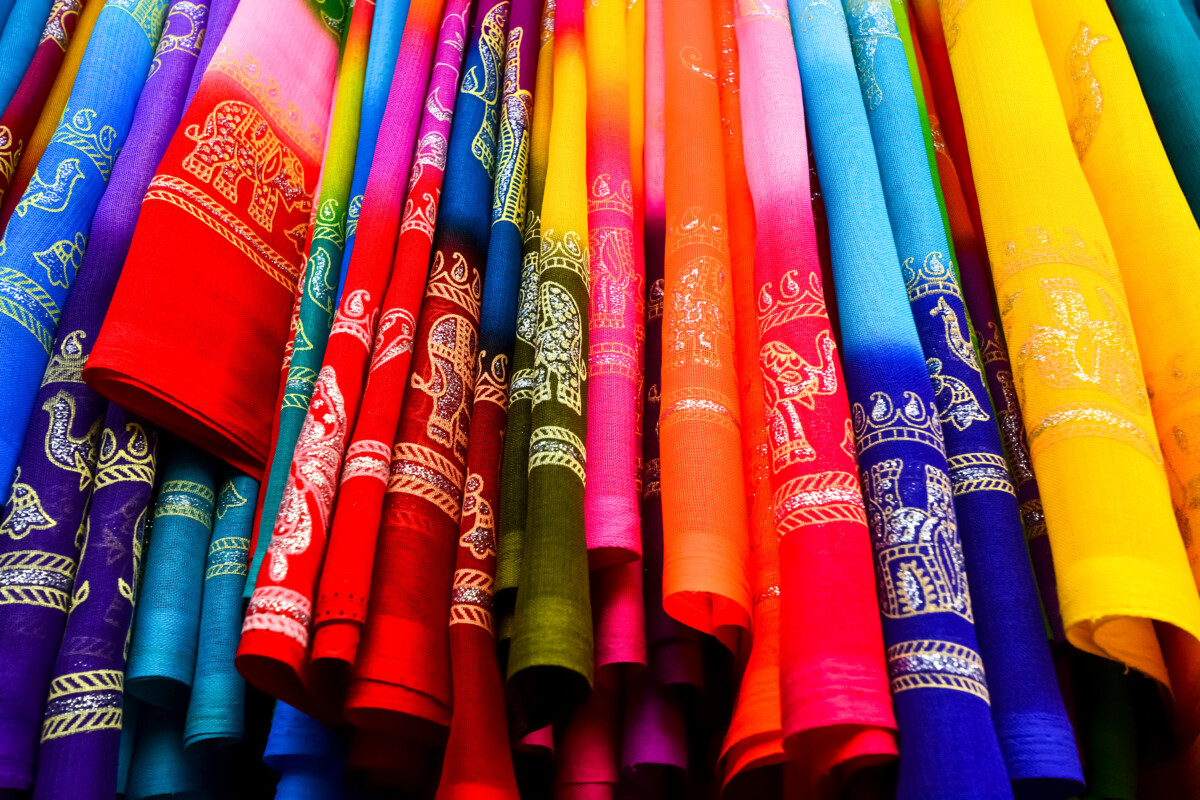 colorful saris displayed in a linear fashion